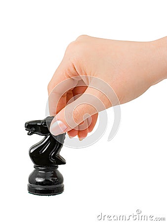 Hand with chess knight Stock Photo