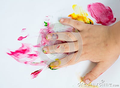 Hand of child while doing fingerpaint Stock Photo