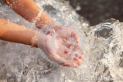 Hand of children get some water for drink from tap Stock Photo