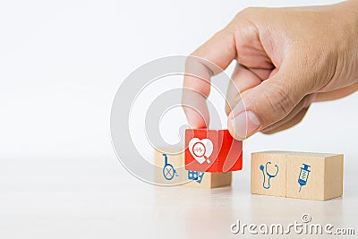 Hand choose heart and heart wave signals icon on cube wooden toy blocks stacked Stock Photo