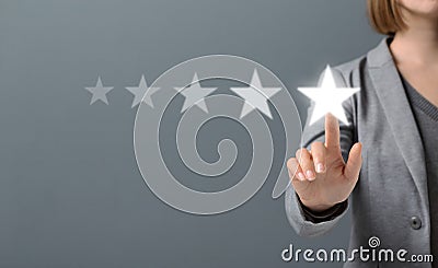 Hand of Client pressing Five Star Excellent survey Rating Stock Photo