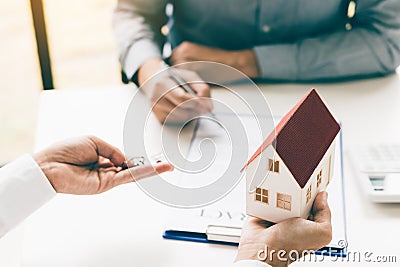 Hand client signing contract paper a real estate or mortgage contract Stock Photo