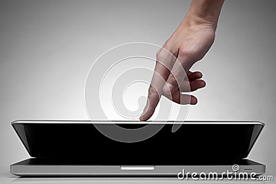 Hand closing laptop on white Stock Photo