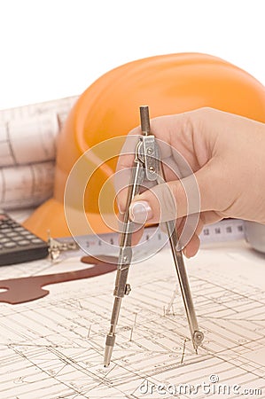 Hand with compasses on the house project Stock Photo