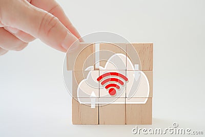 Hand complete cloud icon shape on wood block isolated background for for technology, networking concept Stock Photo