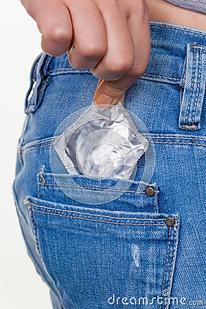 Hand with condom to prevent Stock Photo