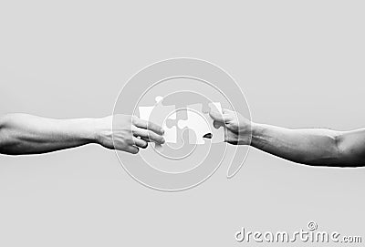 Hand connecting jigsaw puzzle. Business solutions, success and strategy concept Stock Photo