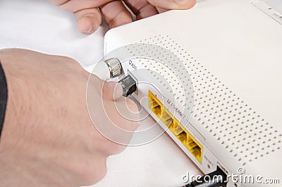 Hand while connecting a router to internet Stock Photo