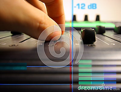 Hand controlling faders Stock Photo