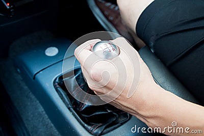 Hand with manual gear in manual transmission car Stock Photo