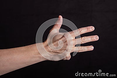 Hand counts four, four fingers outstretched, sign for four Stock Photo