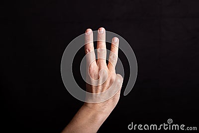 Hand counts two, two fingers outstretched, sign for three Stock Photo