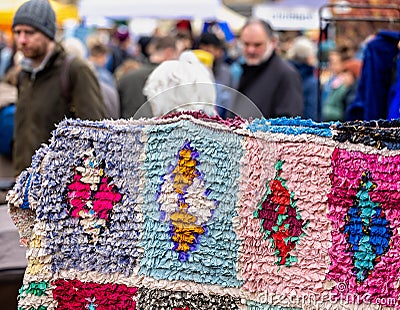 Hand crafted patterned tufted rug on sale at Frome Sunday Market, Somerset, UK Editorial Stock Photo