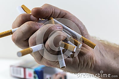 A Hand Crushing Cigarettes Close Up Stock Photo