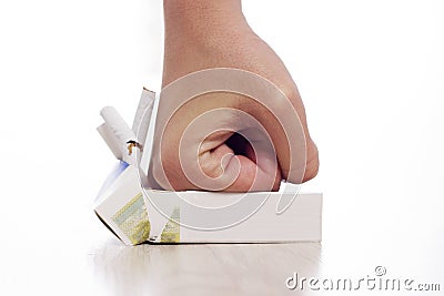 Hand crushing cigarettes Stock Photo