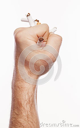 Hand crushing cigarettes Stock Photo