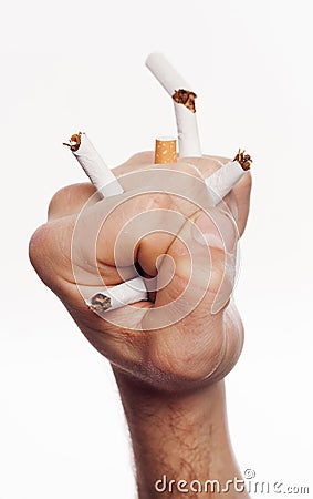 Hand crushing cigarettes Stock Photo