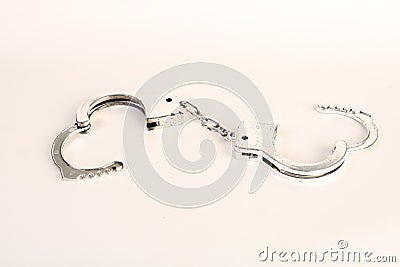 Hand cuffs on a white background Stock Photo