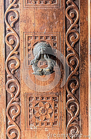 Hand Decorative wooden door and Brass Door Rattle in at Ruvanvelisaya Dagoba Editorial Stock Photo