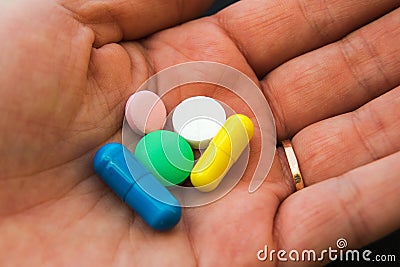 A hand with different pills Stock Photo