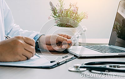 Hand of a doctor holding a pill panel and checking drug in hospital Stock Photo