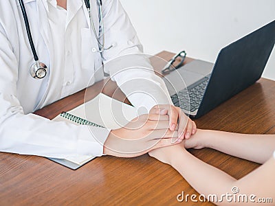 Hand of doctor reassuring her patient. Medical ethics and trust concept Stock Photo