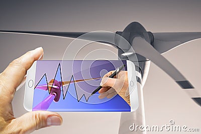 Hand drawing a graph about renewable energies on smartphone Stock Photo