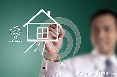 hand drawing house in a whiteboard Stock Photo