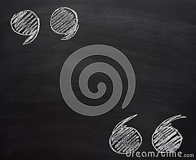 Hand Drawn Doodle Chalk Illustration of Upper and Lower Quotation Marks on Scratched School Blackboard. Blank Mock Up Stock Photo