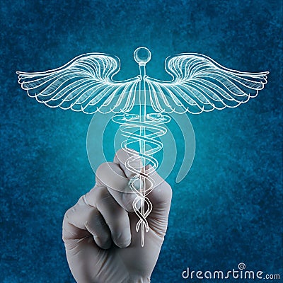 Hand draws Caduceus on white board Stock Photo