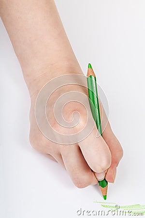 Hand draws by green crayon on sheet of paper Stock Photo