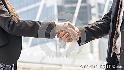 Hand in dressed strictly in the suits shake together Stock Photo