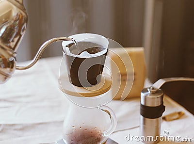 Hand drip coffee, pouring water on coffee ground Stock Photo