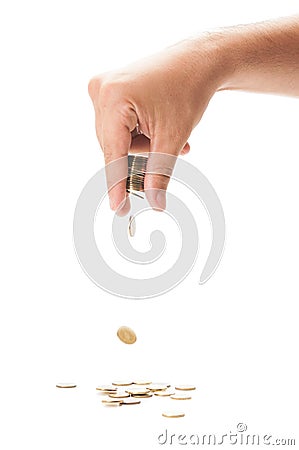 Hand dropping a bunch of coins Stock Photo