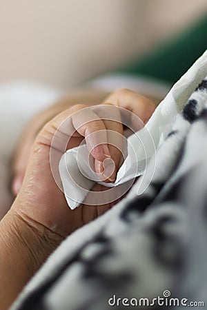 Hand of elderly woman holding handkerchief Stock Photo