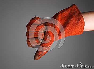 Hand expressing negativity with welder glove Stock Photo