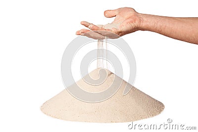 Hand with falling sand on pile Stock Photo