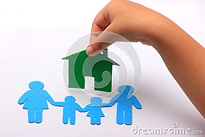 Hand with family icon and green house Stock Photo