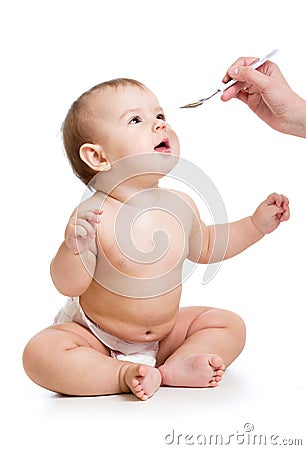 Hand feeding baby with a spoon Stock Photo