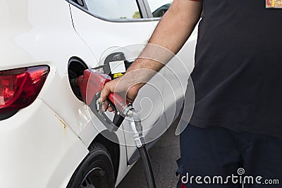 Hand filling tank with fuel pump and pump. Stock Photo