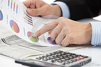 Hand with finance report Stock Photo