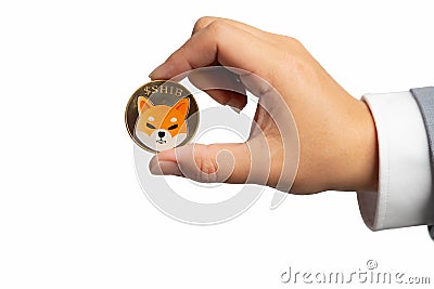 Hand or fingers picking Shiba coin group included with Crypto currency on hand business man in gray suit. Filed and put and give Editorial Stock Photo