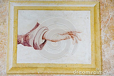 Hand on a fresco at Sacred Mount Orta Stock Photo