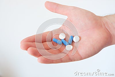 Hand full of medicines pills Stock Photo