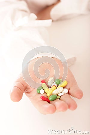 Hand full of pills Stock Photo