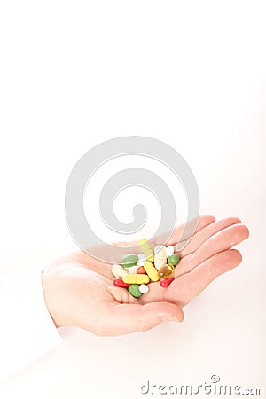 Hand full of pills Stock Photo