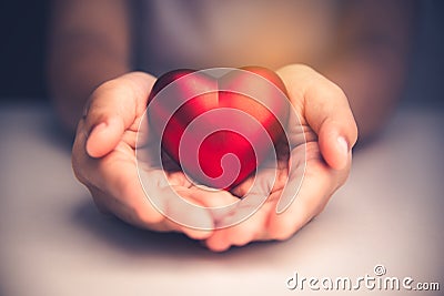 Hand give red heart for love Stock Photo