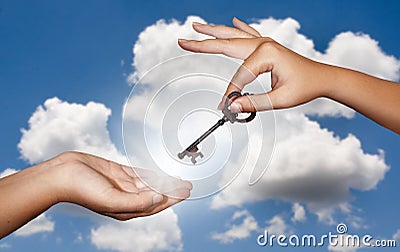 Hand giving key Stock Photo