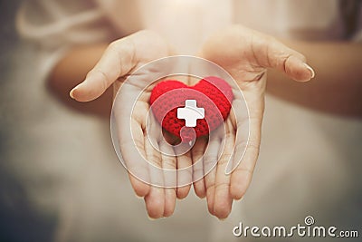 Hand giving red heart for help blood donation healthcare together share love to fight disease concept Stock Photo