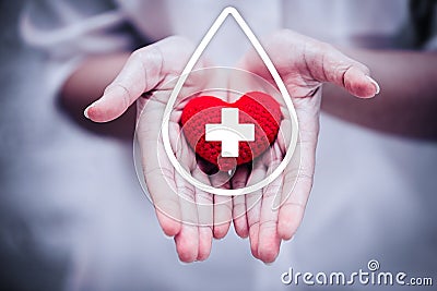 Hand giving red heart for help blood donation hospital Stock Photo